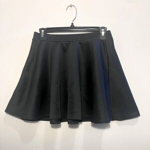 Women’s black short skirt, with ruffles